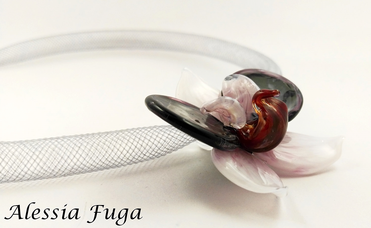 Lampwork white, dark amethyst and pink orchid pendant on a plastic mesh tube necklace made by Alessia Fuga