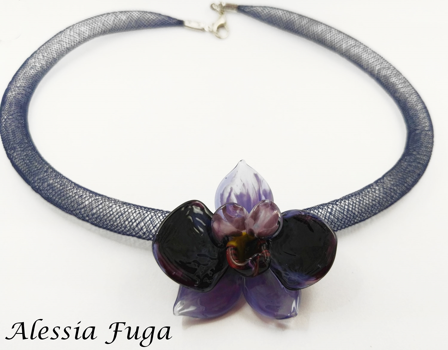 Lampwork wisteria orchlid pendant on a plastic mesh tube necklace front view