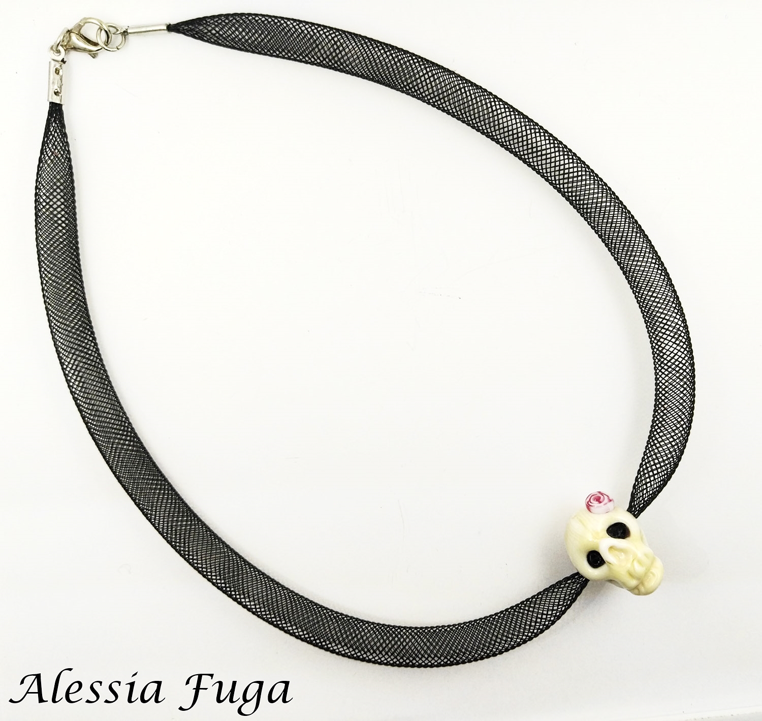 Girly skull with rose murrini on a plastic mesh tube necklace